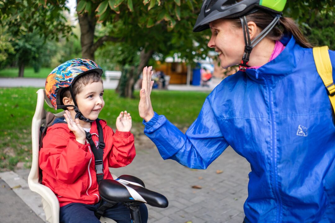 happy mom with child on bike